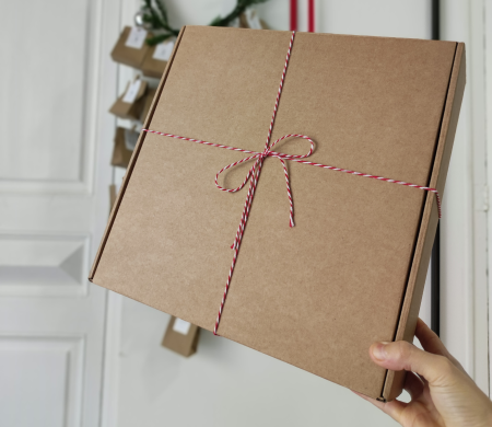 Cardboard shipping box with Christmas decorations Cardboard shipping box with Christmas decorations