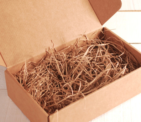 Paper shavings for cardboard boxes