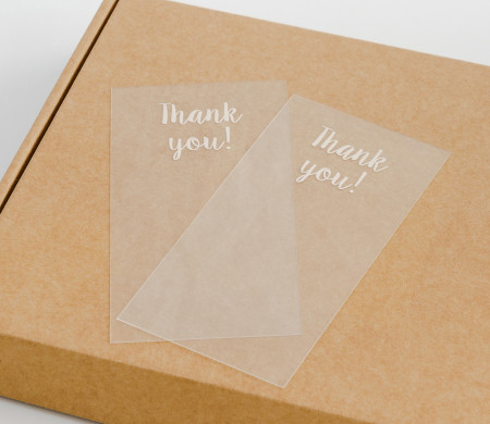 Transparent "Thank you" label for deliveries.