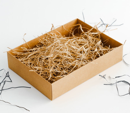 Paper shavings for cardboard boxes