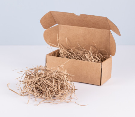Paper shavings for cardboard boxes