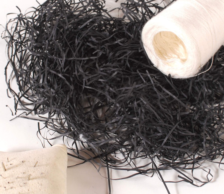 Paper shavings for cardboard boxes