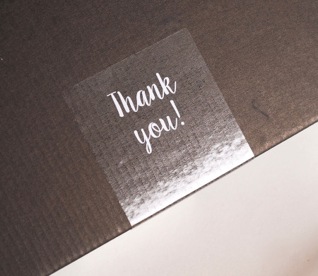 Transparent "Thank you" label for deliveries.