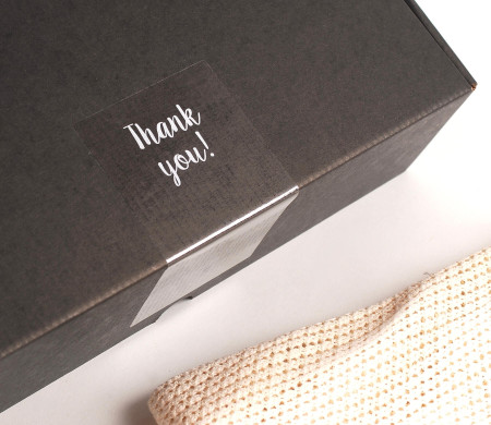 Transparent "Thank you" label for deliveries.