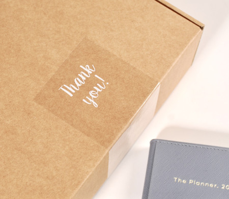 Transparent "Thank you" label for deliveries.