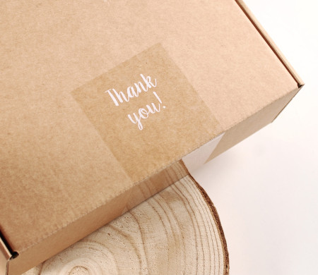 Transparent "Thank you" label for deliveries.