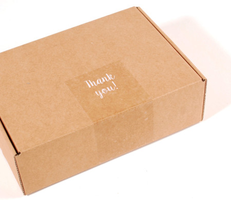 Transparent "Thank you" label for deliveries.