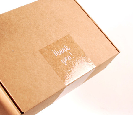 Transparent "Thank you" label for deliveries.