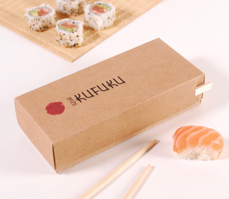 Cardboard box for sushi with a stick compartment